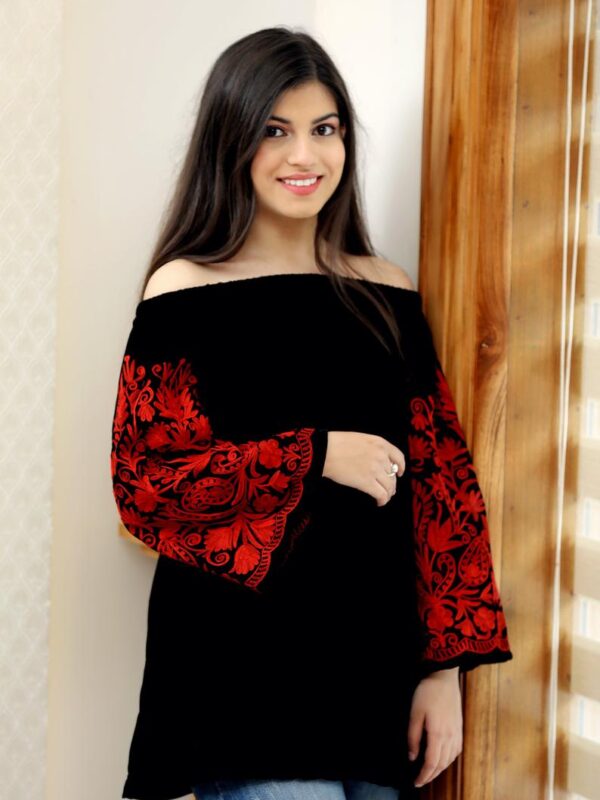 Black Off Shoulder Top with Red Embroidered Sleeves close up