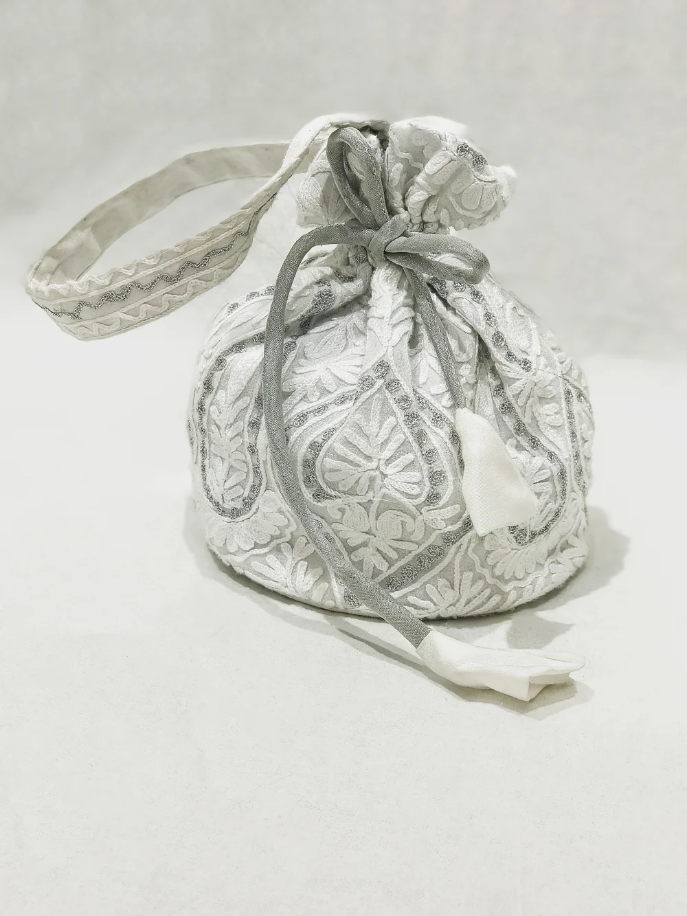 Georgette Zari and Aari Jaal Embroidered White Potli Bag front