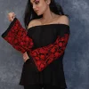 Black Off Shoulder Top with Red Embroidered Sleeves front