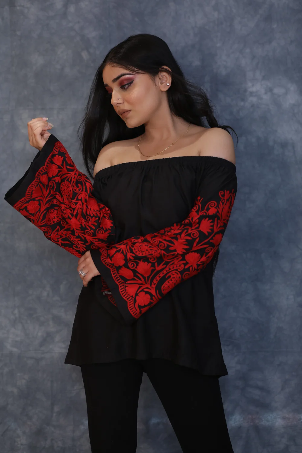 Black Off Shoulder Top with Red Embroidered Sleeves front