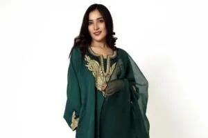 model wearing green salwar suit